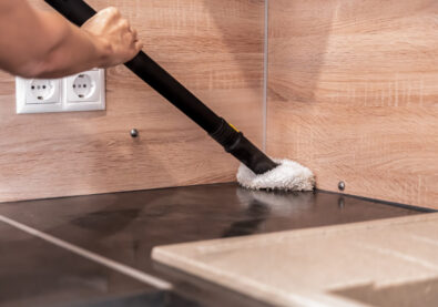 Kitchen cleaning with a steam cleaner, care for cleanliness and biologically clean treatment for removing dirt, care for the health and cleanliness of the kitchen and living spaces