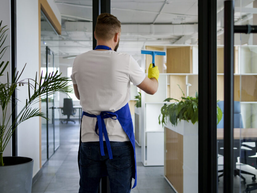 professional-cleaning-service-person-cleaning-office-window professional-cleaning-service-person-cleaning-office-window