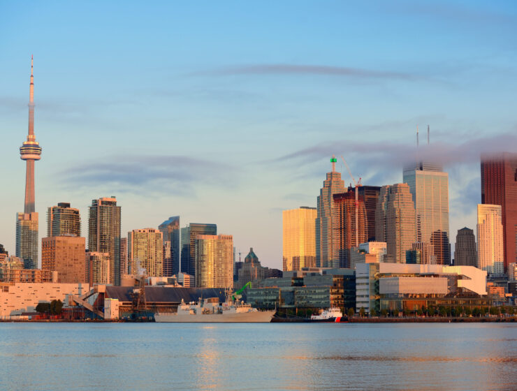 Toronto sunrise with sunlight reflection over lake in the morning